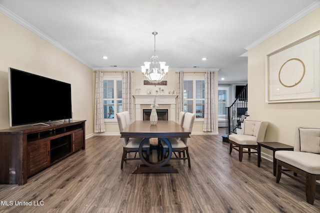 4424 Rebekah Dr, Olive Branch, MS 38654 - dining room with crown molding, wood finished floors, a chandelier, recessed lighting, and a high end fireplace