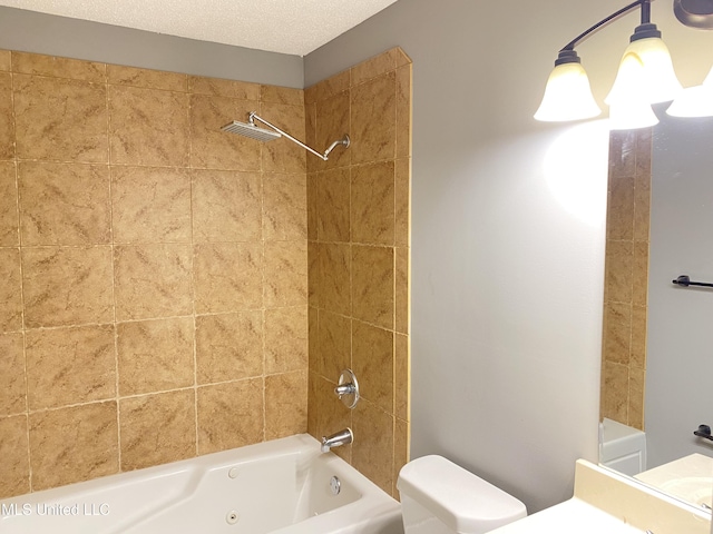 bathroom with tiled shower / bath, a textured ceiling, and toilet