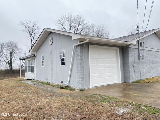 view of side of property featuring a garage