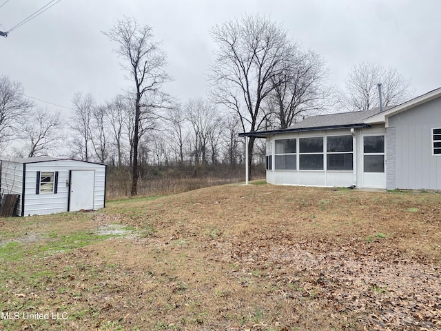 view of yard featuring a sunroom