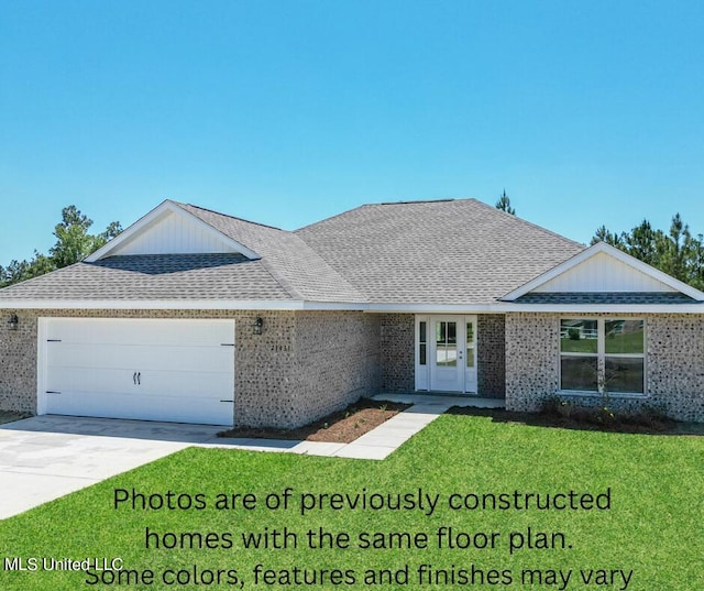 ranch-style home with a front yard and a garage