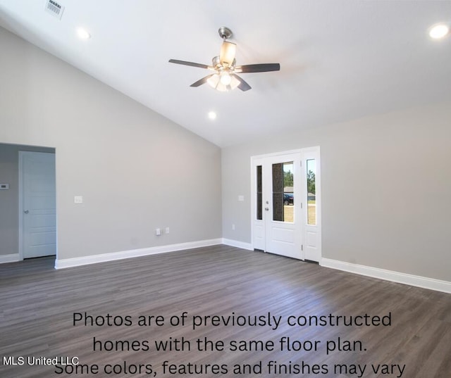 empty room with dark wood-type flooring, ceiling fan, and lofted ceiling