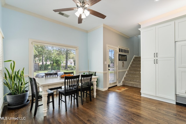 dining space with crown molding, ceiling fan, and dark hardwood / wood-style flooring