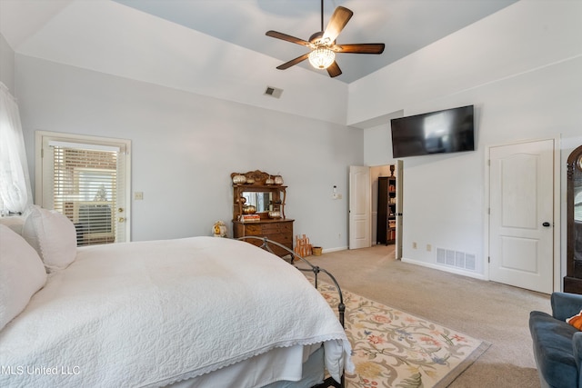 bedroom featuring light carpet and ceiling fan