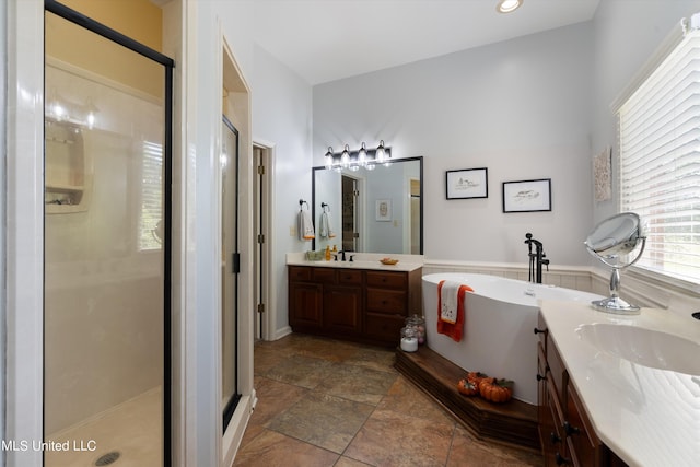 bathroom featuring vanity and plus walk in shower