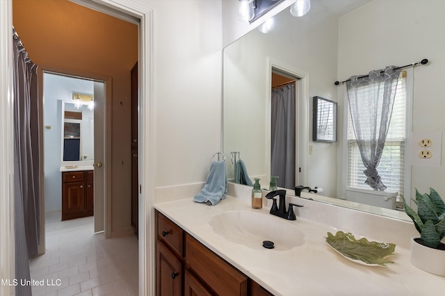 bathroom with vanity and tile patterned floors