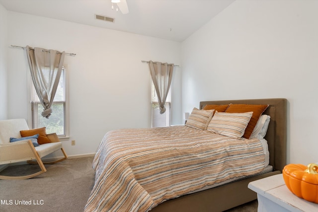 bedroom featuring multiple windows, carpet floors, and ceiling fan