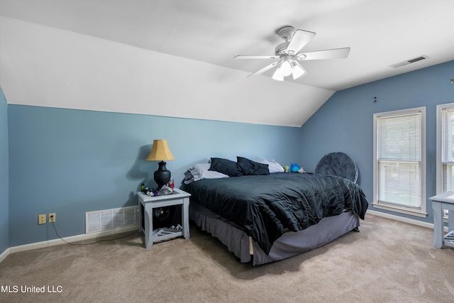 carpeted bedroom featuring lofted ceiling and ceiling fan