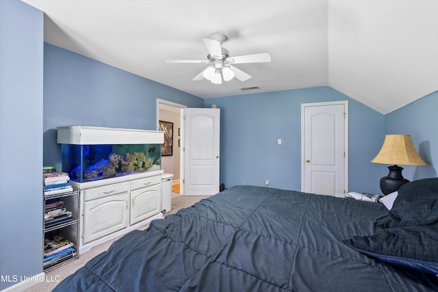 carpeted bedroom featuring ceiling fan and lofted ceiling