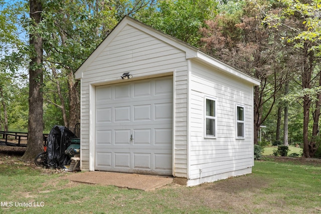 garage with a lawn