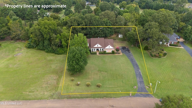 birds eye view of property with a rural view