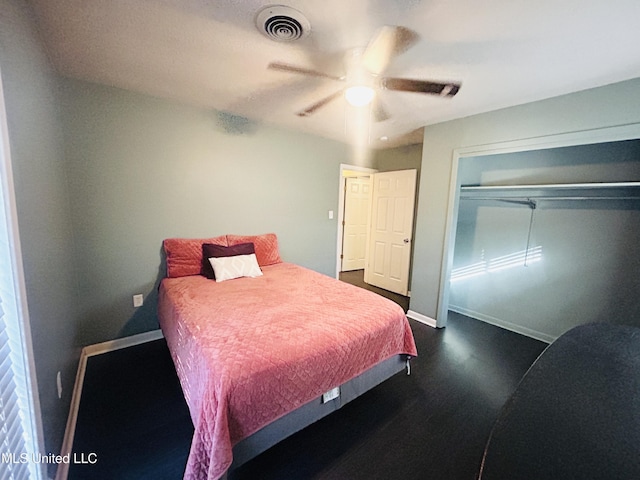 bedroom with ceiling fan and a closet