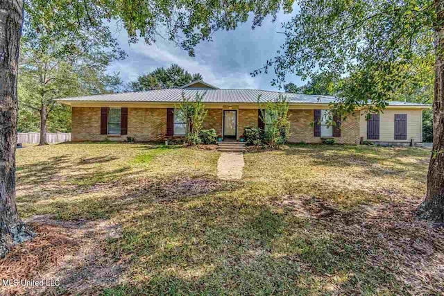 ranch-style home featuring a front yard