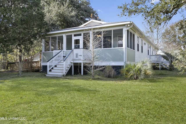 view of front of home featuring a sunroom and a front lawn