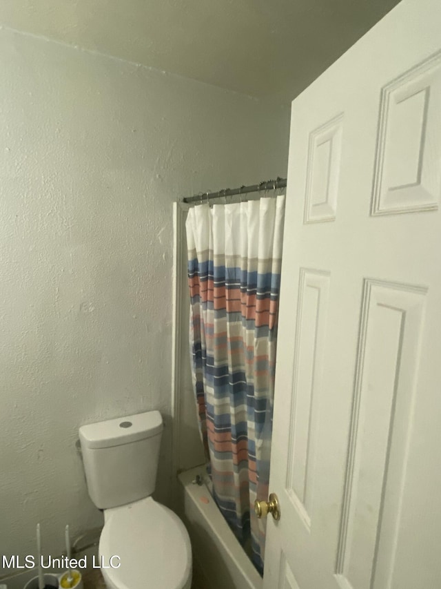 351 E Academy St, Canton, MS 39046 - bathroom with toilet and shower / bath combination with curtain