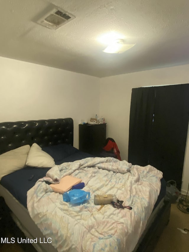 351 E Academy St, Canton, MS 39046 - bedroom featuring a textured ceiling
