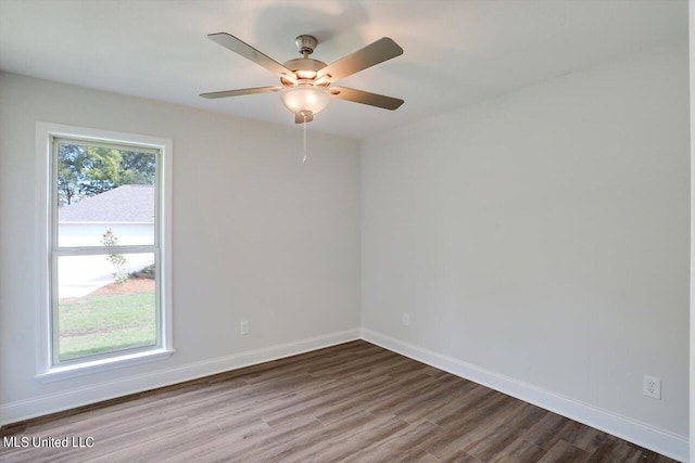 empty room featuring wood-type flooring and ceiling fan