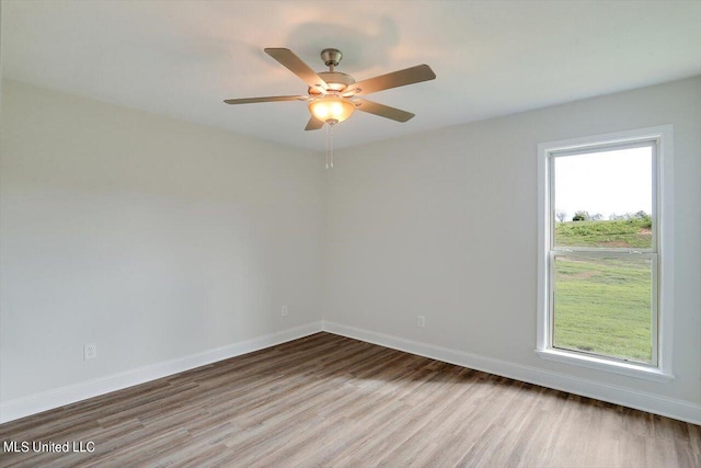 unfurnished room featuring wood-type flooring and ceiling fan