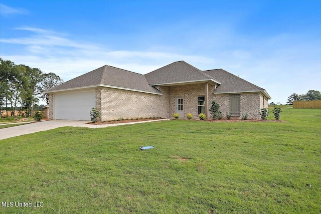 view of front of house featuring a garage and a front lawn