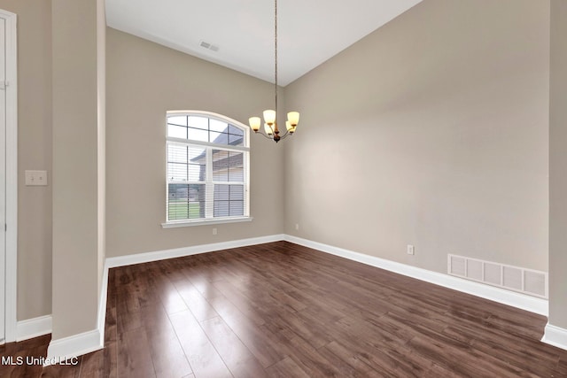 2338 Khushboo Cv, Southaven, MS 38671 - unfurnished room with a chandelier, dark wood-style floors, and lofted ceiling