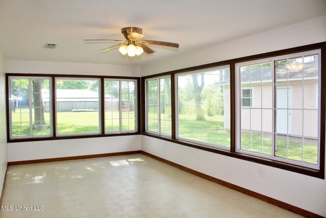 unfurnished sunroom with baseboards and visible vents