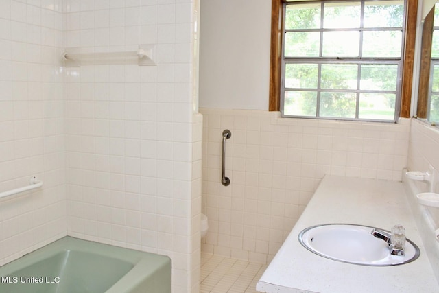 full bathroom with plenty of natural light, walk in shower, and a bathing tub