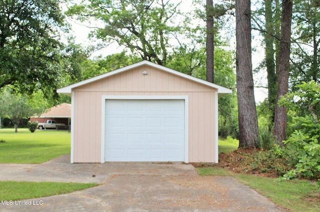 detached garage featuring driveway