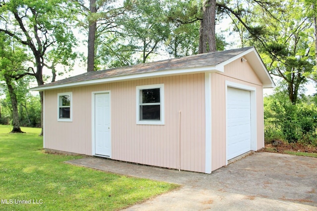 view of outbuilding with an outdoor structure and driveway