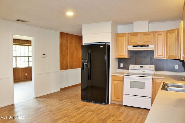 kitchen featuring electric range, visible vents, light wood finished floors, black refrigerator with ice dispenser, and under cabinet range hood