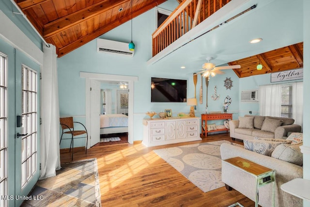 living room featuring a wall mounted air conditioner, wood-type flooring, wooden ceiling, and beamed ceiling