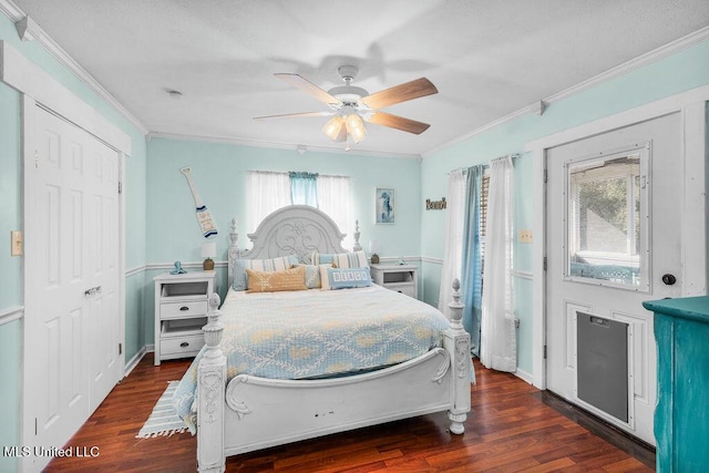 bedroom with crown molding, ceiling fan, and dark hardwood / wood-style flooring