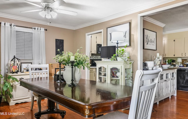dining area with wood finished floors, a ceiling fan, and ornamental molding