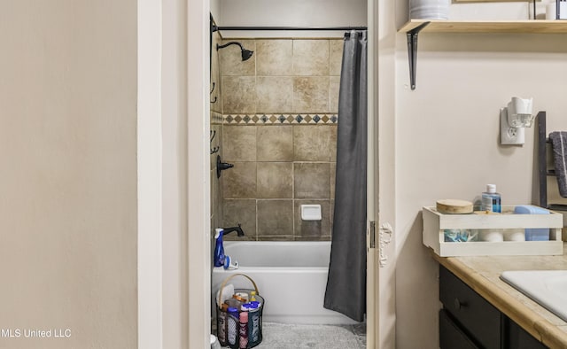 bathroom featuring shower / bath combo and vanity