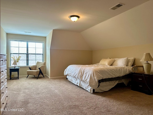 bedroom featuring light carpet and lofted ceiling