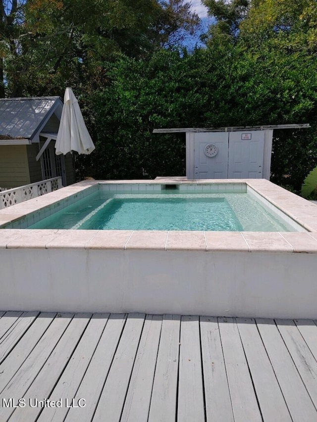 view of pool featuring a deck