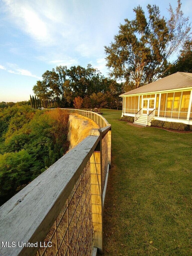 view of yard with a sunroom