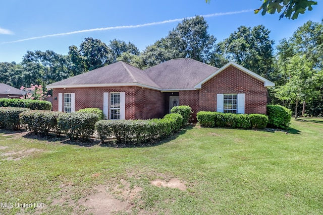 ranch-style house featuring a front yard