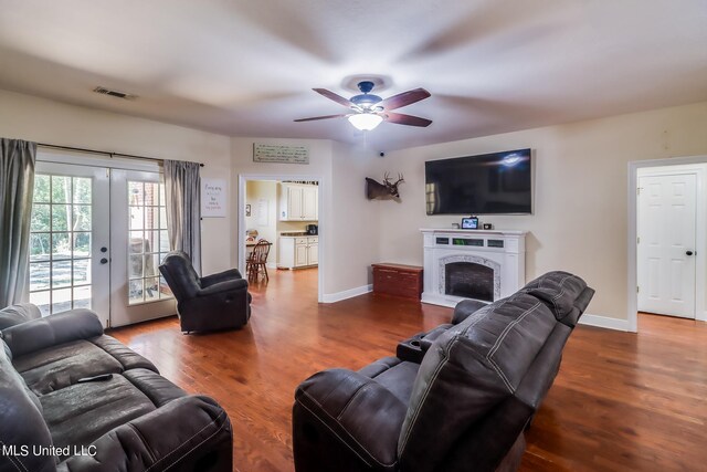 living room with french doors, hardwood / wood-style flooring, and ceiling fan