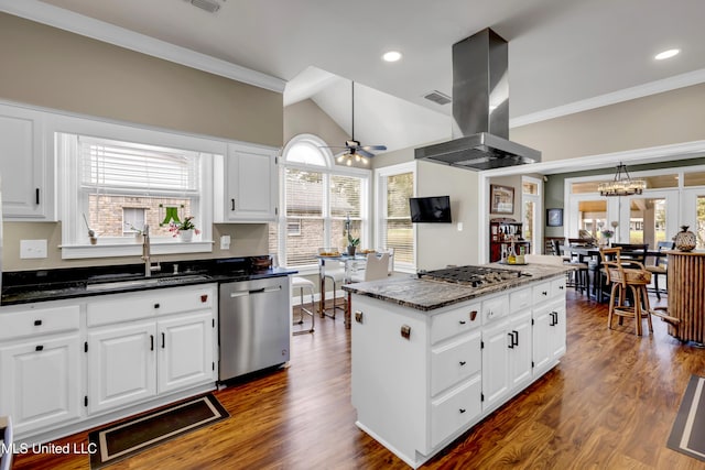 kitchen with appliances with stainless steel finishes, island exhaust hood, dark wood-type flooring, and a sink