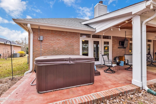 view of patio / terrace featuring a hot tub