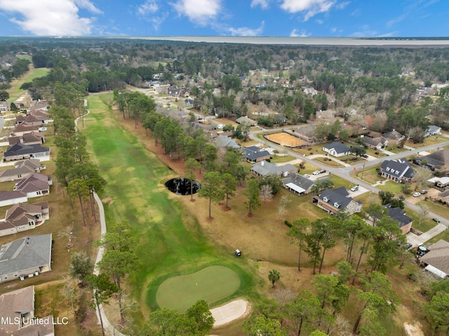 drone / aerial view with a residential view and golf course view