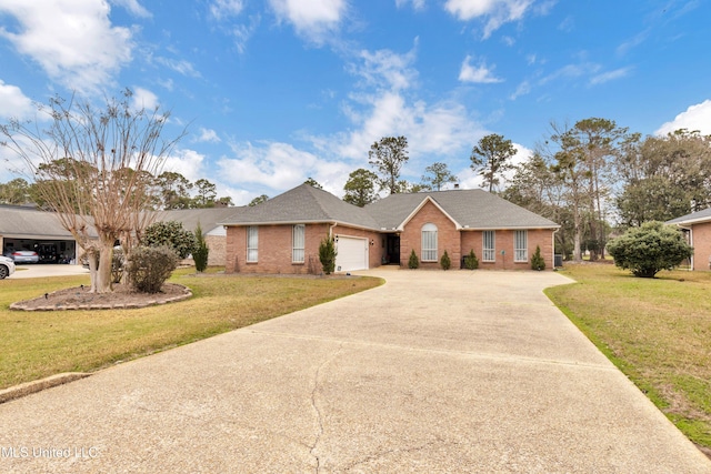 ranch-style home featuring a garage, driveway, brick siding, and a front yard