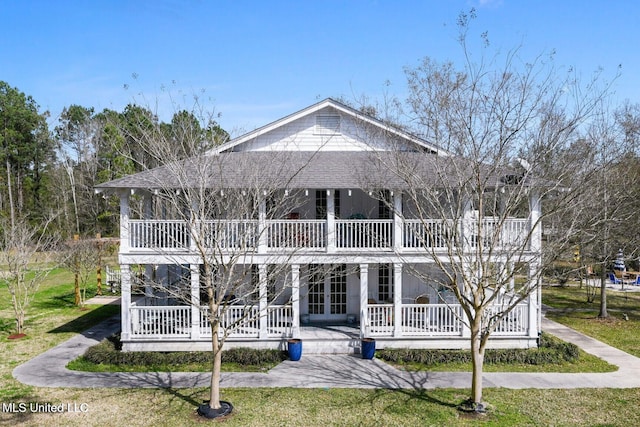 6131 Jenness Rd, Pearlington, MS 39572 - back of house featuring french doors, a porch, a balcony, and a lawn