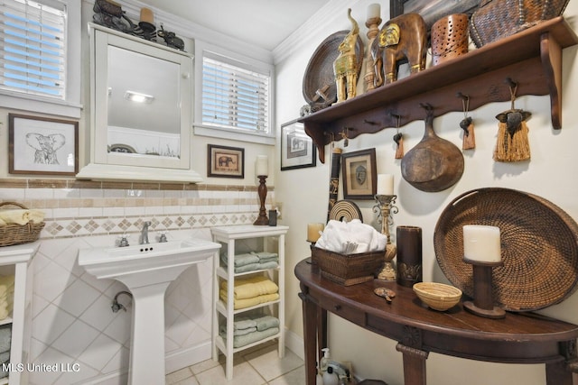 6131 Jenness Rd, Pearlington, MS 39572 - bathroom featuring tile patterned flooring, ornamental molding, and a sink