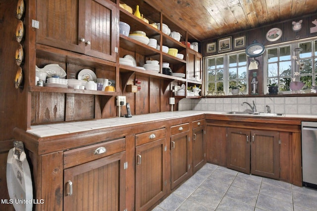 6131 Jenness Rd, Pearlington, MS 39572 - bar with a sink, light tile patterned flooring, dishwasher, wooden ceiling, and decorative backsplash