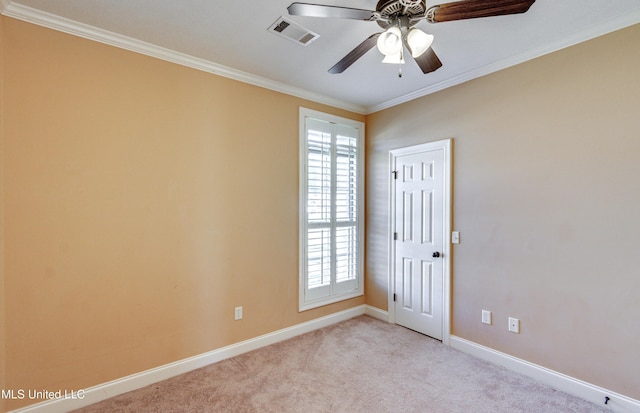 unfurnished room with ceiling fan, ornamental molding, and light carpet