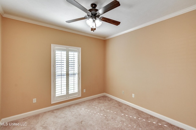 empty room with ceiling fan, light colored carpet, and crown molding