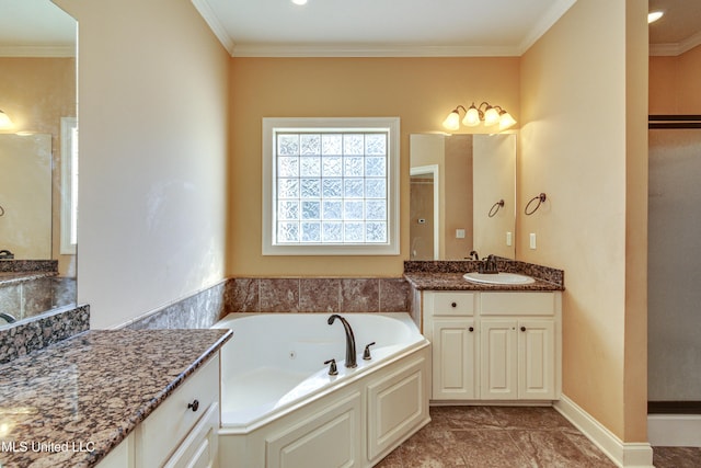 bathroom with a tub to relax in, vanity, and ornamental molding