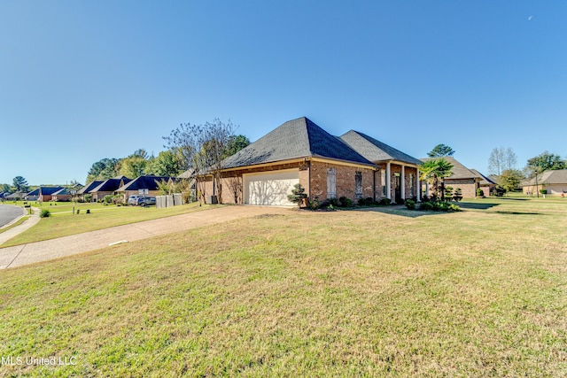 view of front facade with a front yard and a garage