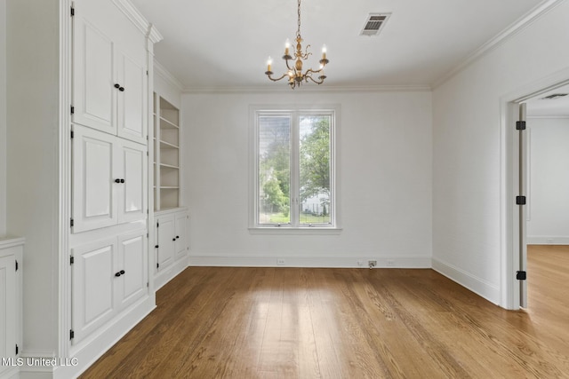 13 Highland Meadows Dr, Jackson, MS 39211 - unfurnished dining area with a chandelier, light wood-style flooring, and ornamental molding